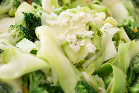 Green fresh sprinkled with garlic. Raw foodの写真素材