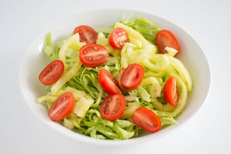 Dish with vegetable salad, tomatoの写真素材