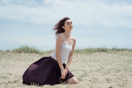 Young woman dancing in natureの写真素材
