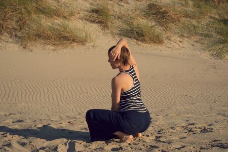 Woman dancing performance on the sandの写真素材