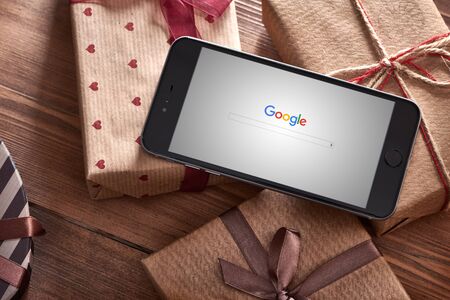 PRAGUE, CZECH REPUBLIC - SEPTEMBER 1, 2015: New Google logo on their search page immediately at the release date is displayed on black iphone 6 plus.のeditorial素材