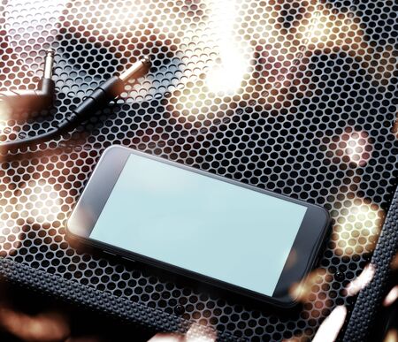 Template of black modern smartphone turned left with audio speaker background. Clipping pathの写真素材