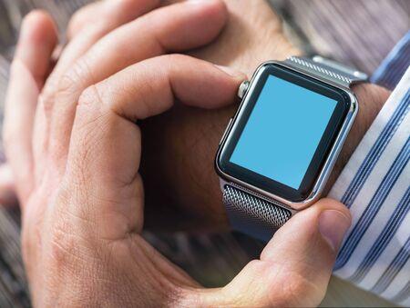 Man Setting Up Digital Watch Appの写真素材
