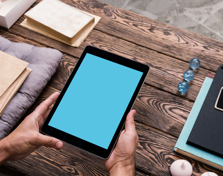 Digital tablet computer in male handsの写真素材