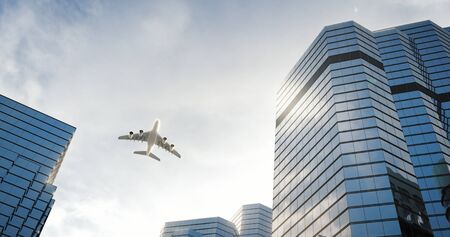 Airplane flies over skyscrapers at the city. 3D renderの写真素材