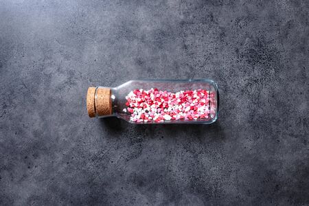 Glass jar with a lot of heart shapes insideの写真素材