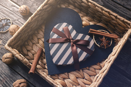Cute heart shaped gift box in a wicker basket