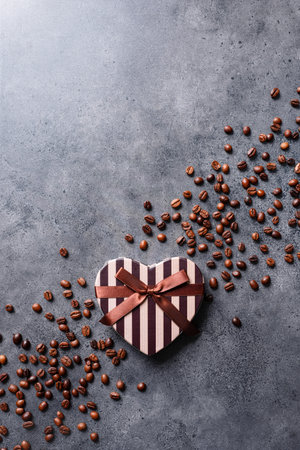 Heart shaped gift box with coffee beans aroundの写真素材