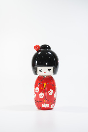 Japanese with red traditional suit ceramic doll toyの写真素材