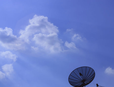 sunlight through the clouds come down like a satellite dish of receiving signals from satellites.の写真素材