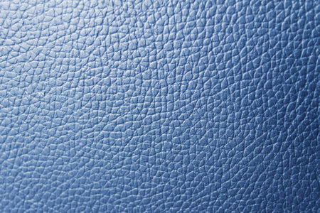 Office chair with a rough surface which is made of leather.