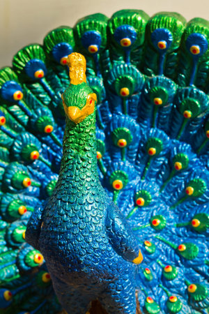 Colorful peacock statue of lime plaster to be adorned with sacred things in the house.の写真素材