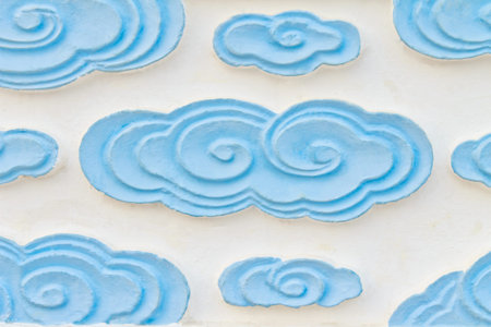 The blue cloud, with cement statues carved in the Chinese Shrineの写真素材