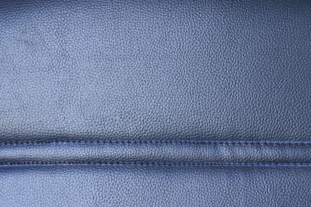 Office chair with a rough surface which is made of leather