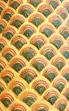 Carved naga scale green and yellow backgroundの写真素材