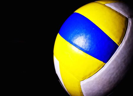 Volleyball, white, yellow, blue  The light and dark background の写真素材