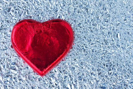 red heart on foil paper の写真素材