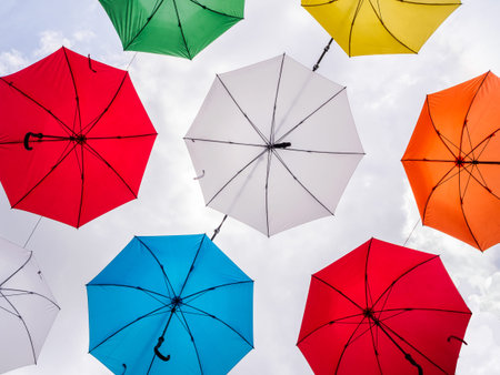 colorful umbrella on cloudsの写真素材