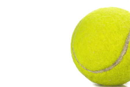 tennis ball isolated on whiteの写真素材