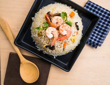 Fried rice with shrimps on wood top viewの写真素材