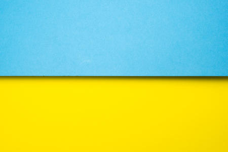 abstract colored paper blue yellow backgroundの写真素材
