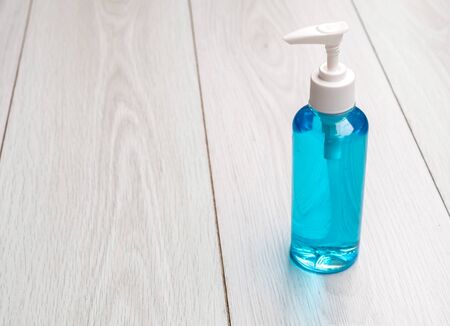 alcohol sanitizer gel hand wash on wood table top view copy space for covid-19 Coronavirus prevention concept copy spaceの写真素材
