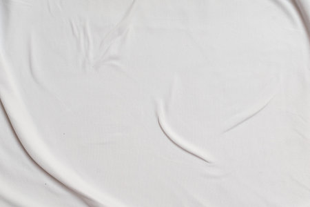 Closeup rippled soft white fabric texture background