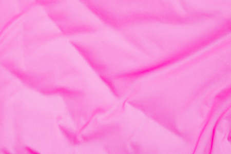 Closeup rippled soft pink fabric texture backgroundの写真素材