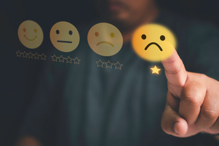 Customer unhappy service and Satisfaction concept ,Client touching virtual screen on Smiley face icon to give satisfaction in service. 1-star rating negative feedbackの写真素材