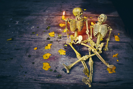 Skeleton lovers sit talking on holidayの写真素材