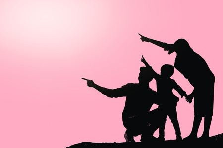 Happy family image Parents and son are pointing the same way.の写真素材