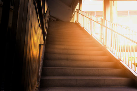 Step up and down between the top and bottom. The sun shines in the morning. Energy-saving ideas and exercises by walkingの写真素材