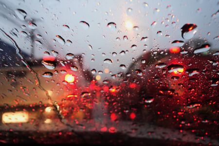 Water drops on the windshield. in the atmosphere of the road in the rain.の写真素材