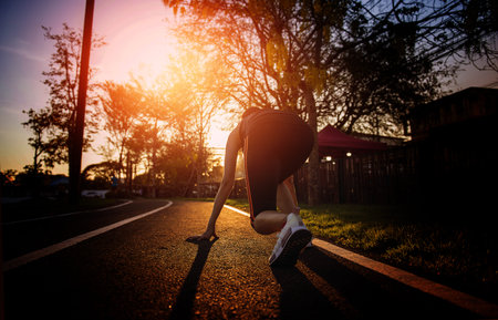 Female runners stand up to move forward. lifestyle and health initiatives.