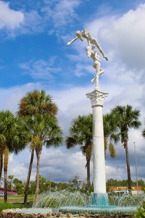 Mermiad staute and fountain in front of Weeki Wachee State Park on a sunny day. - Weeki Wachee Florida July 7, 2019のeditorial素材