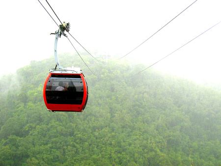 Cable car cabins on mountain peakの写真素材