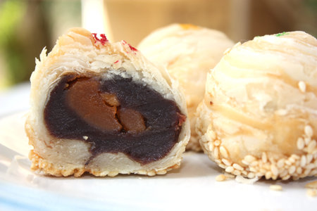 Three Tradditional dessert with one cut up half to show egg yolk