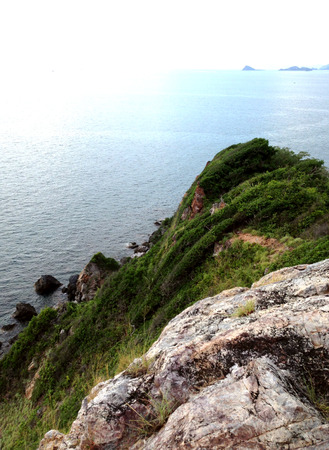 green hill by the seaの写真素材