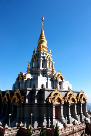 Beautiful golden pagoda with blue sky, Thailandの写真素材