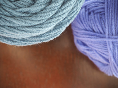 wool yarn on a wooden backgroundの写真素材