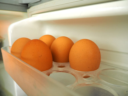 Open refrigerator of eggs inside, food.