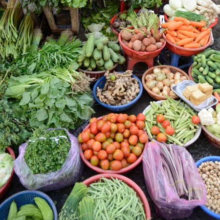 A shot of colorful vegetables on a morning market stall in Vietnam の写真素材