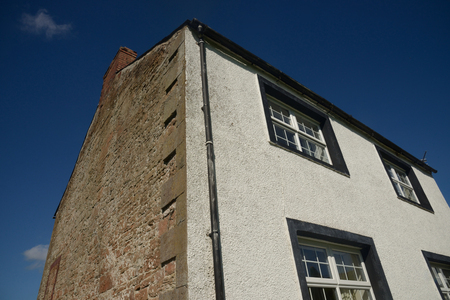 Country farm house front and sideの写真素材