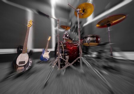 Drums and guitars in music rehearsal room.の写真素材