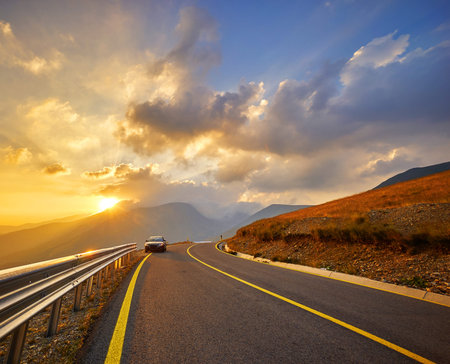 Sunset on Transalpina Highway in Romanian Mountains.の写真素材