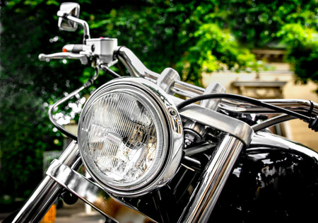 Vintage black motorbike with round headlight.の写真素材