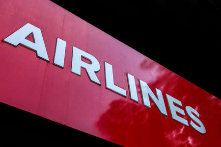 Airlines text written with white on red background.の写真素材