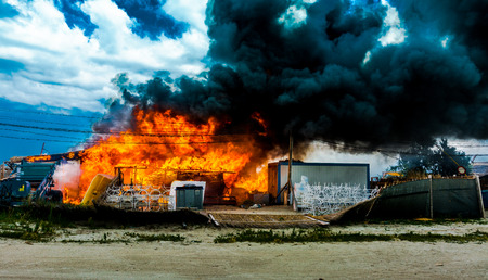 Building on fire with thick smoke.の写真素材