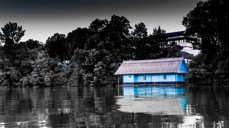 Wooden house on lake in Herastrau Park, Bucharest.の写真素材