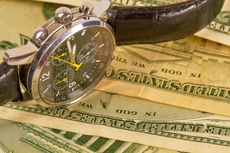 Time is Money Concept with Watch and Dollar Bills.の写真素材